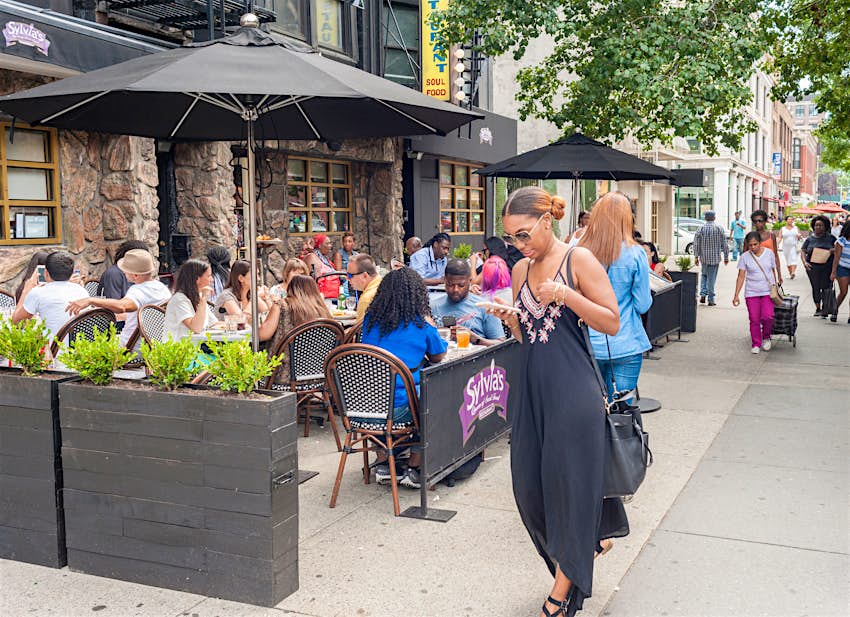 New York NY/USA-August 6, 2017 Al fresco dining outside the world-renowned Sylvia's restaurant in Harlem in New York; Shutterstock ID 1758950624;