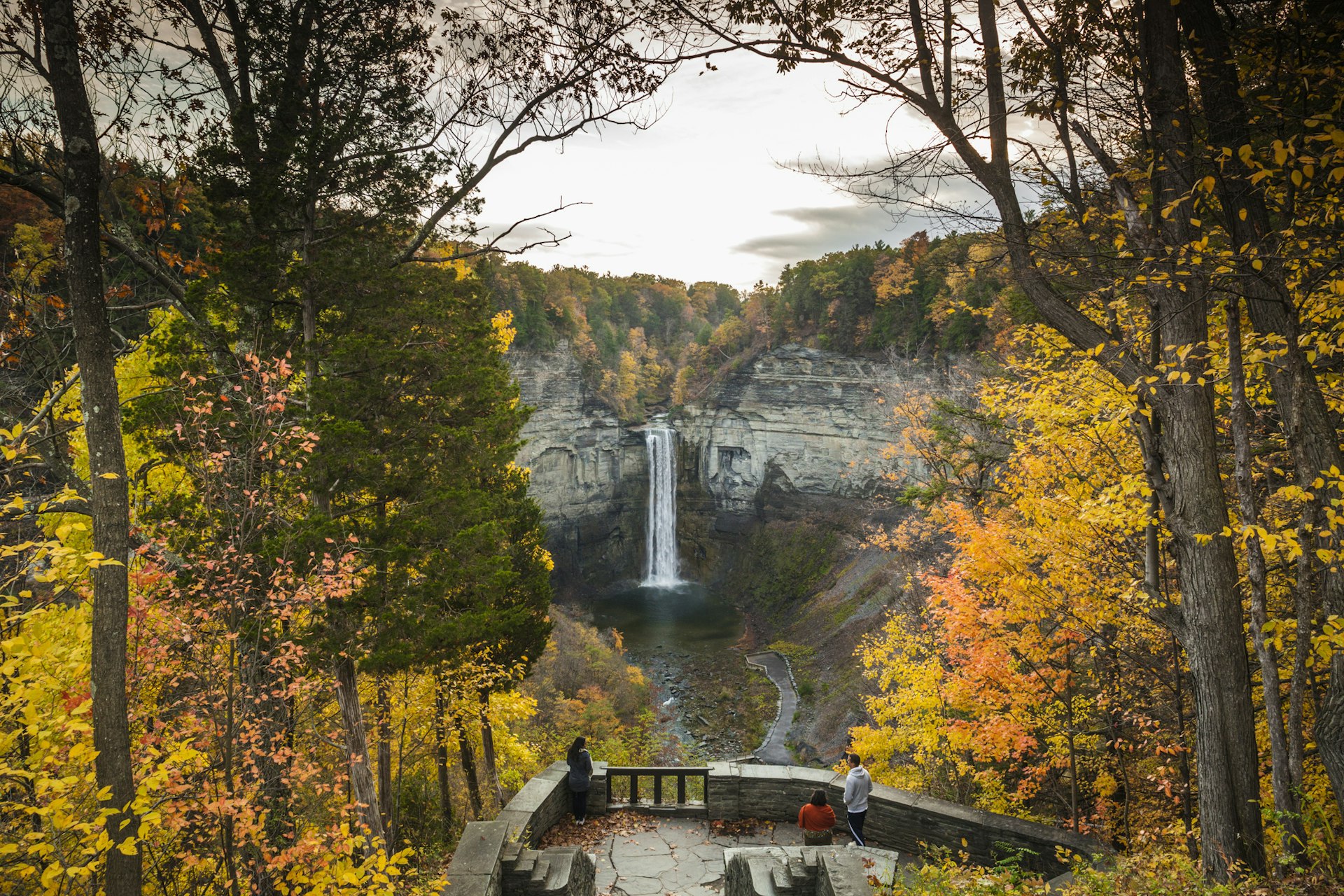 A view of Taughannock Falls waterfall surrounded by trees in fall