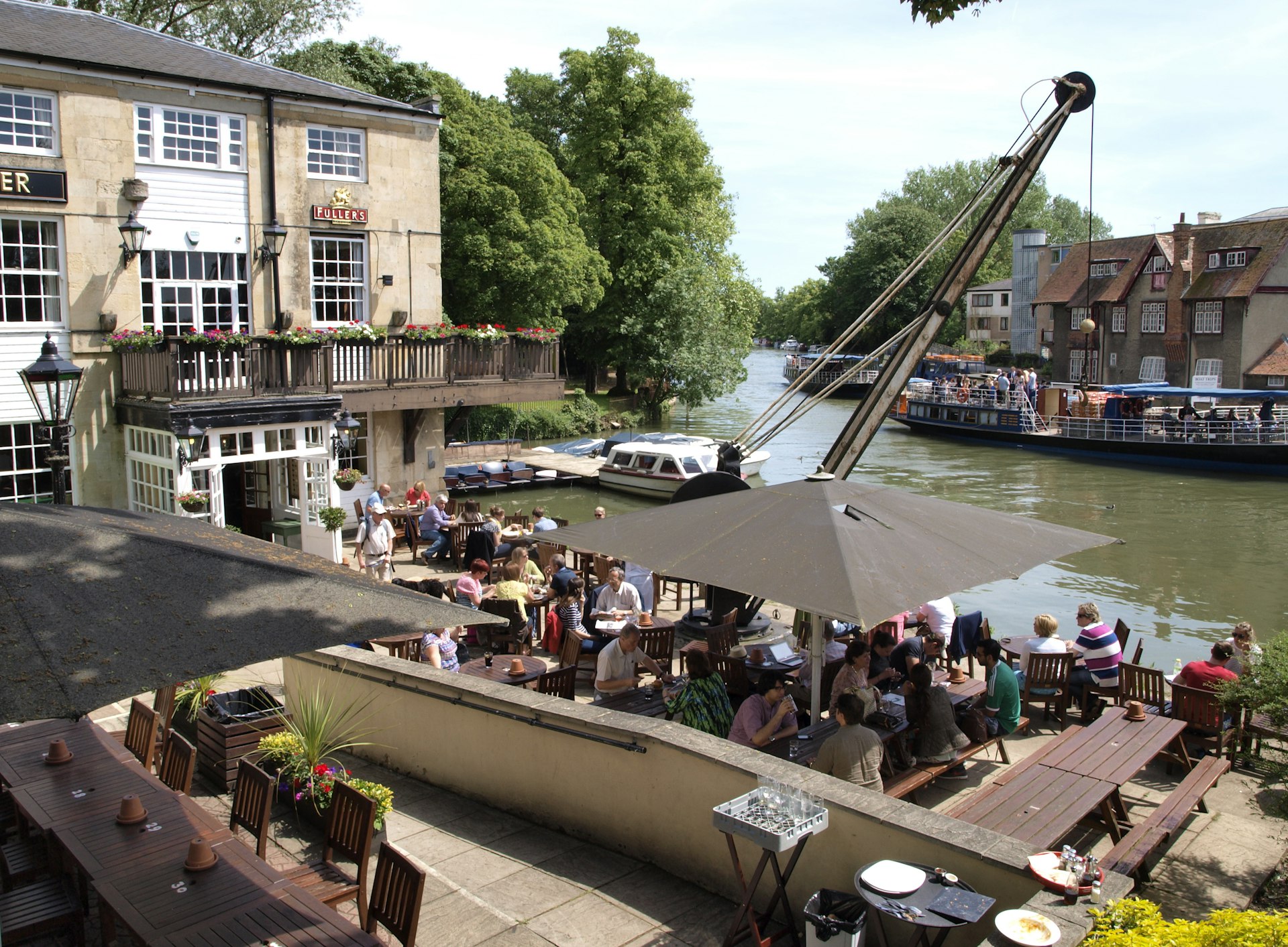 The Head of the River Pub, Oxford. The river-side pub has a beer garden that is full of people drinking and socialising.
