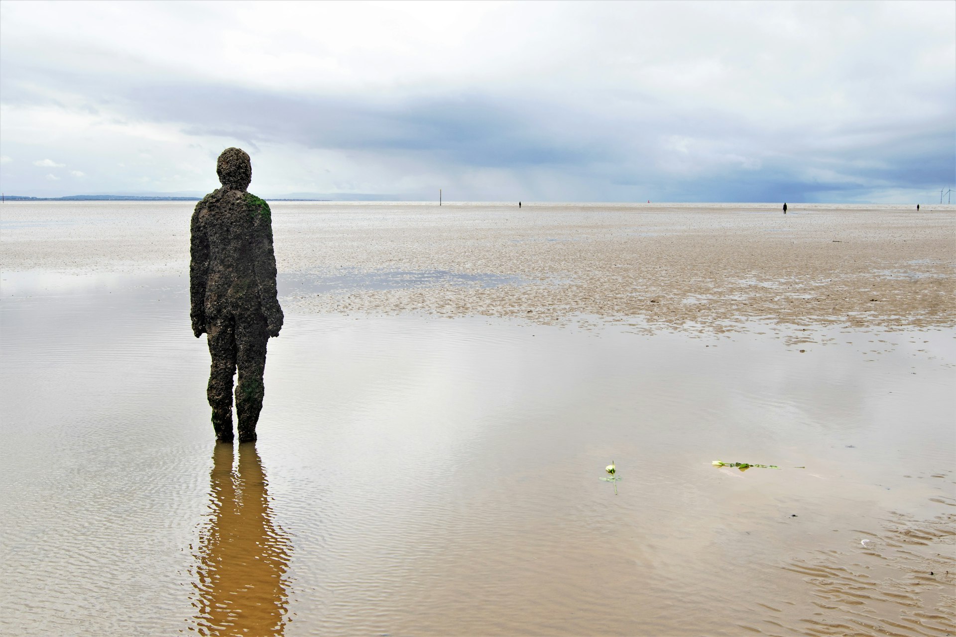 Statues called 'Another Place' by Anthony Gormley, now a permanent feature at Crosby Beach.