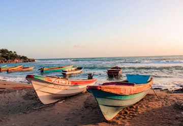 Boats on the beach for sunset.