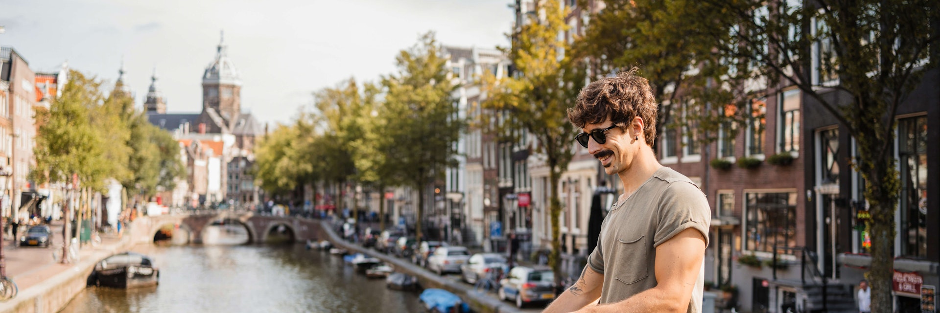 Man riding bike through Amsterdam.
