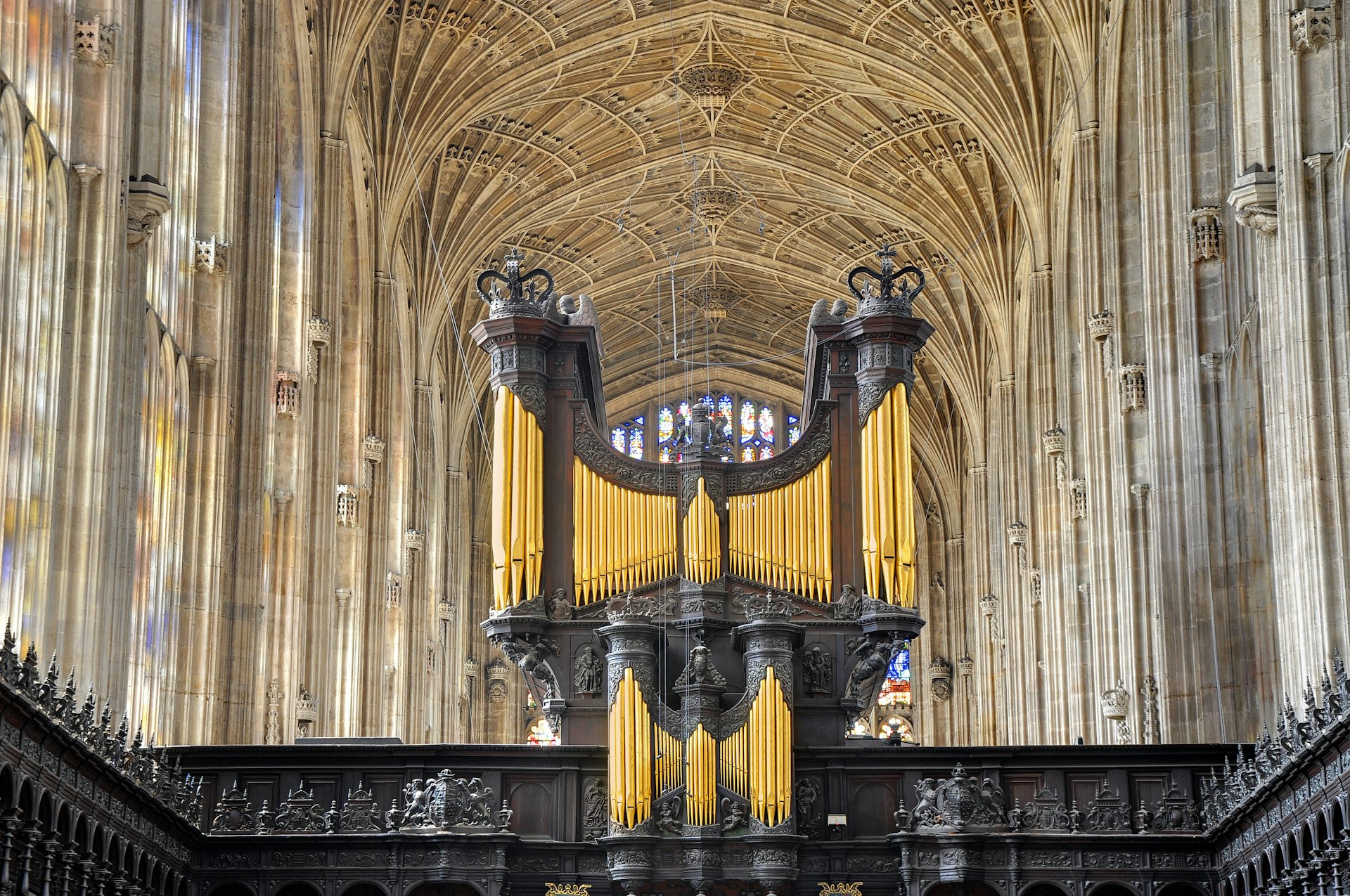 an ornate ceiling and church organ