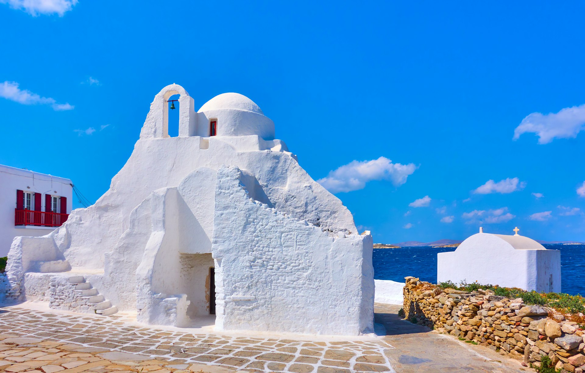 Ancient Panagia Paraportiani, a small white church, on Mykonos Island on a clear day