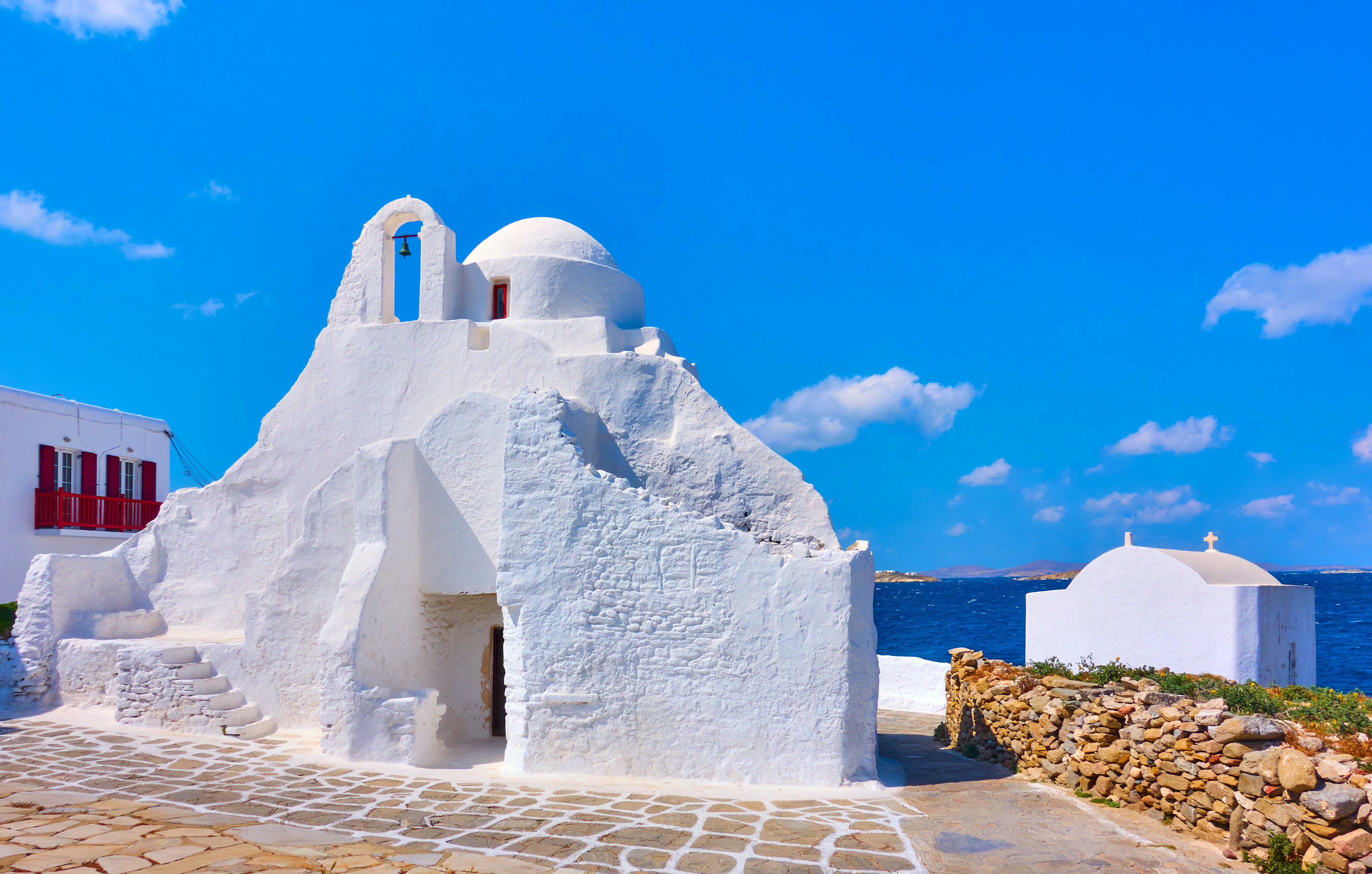 Ancient Panagia Paraportiani, a small white church, on Mykonos Island on a clear day