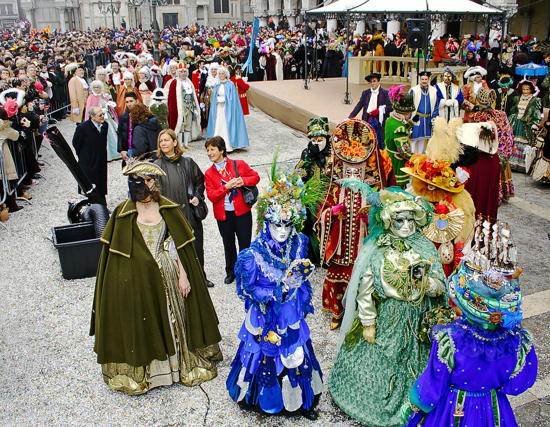 Colourful costumed and masked participants in the Carnival in Venice. 