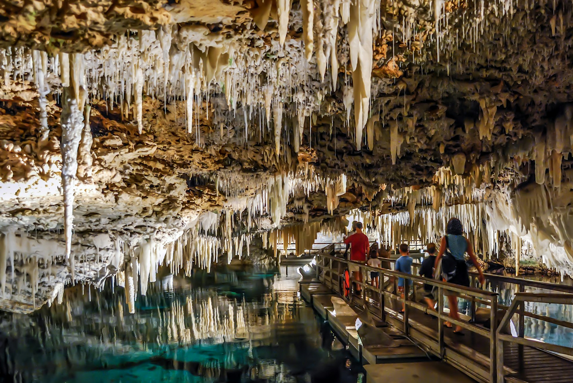 People walking under the stalactites of Bermuda's Crystal Cave