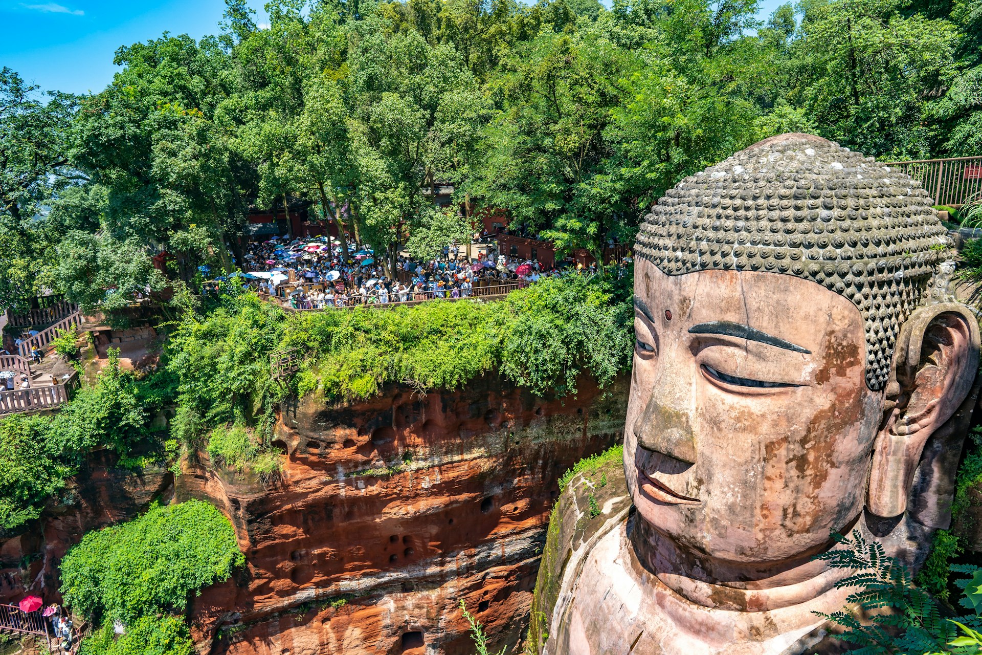 Tourists viewing the head of the Le Shan Grand Buddha