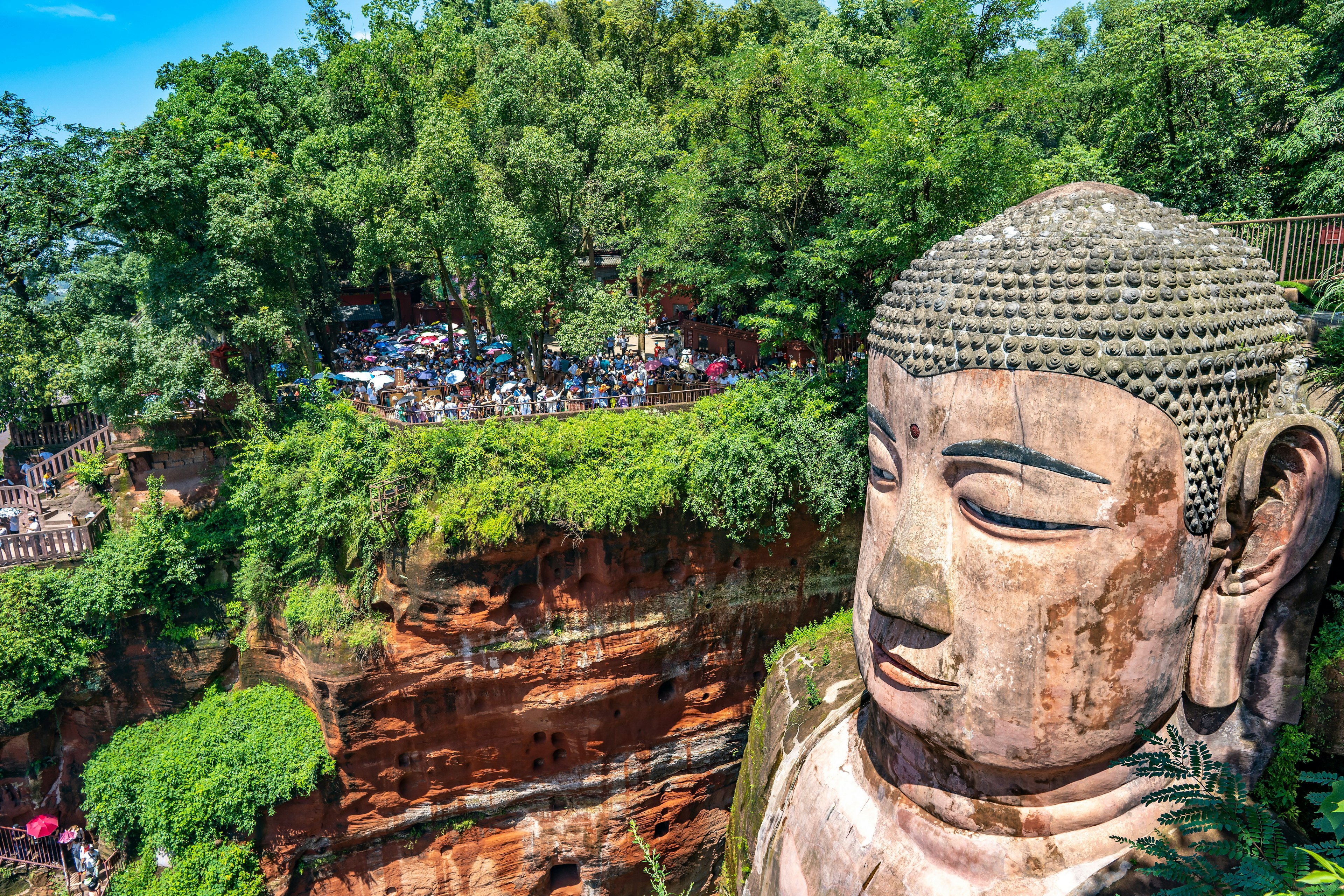 Tourists viewing the head of the Le Shan Grand Buddha