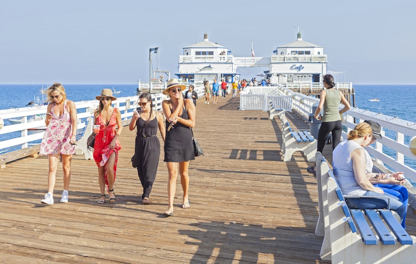 MALIBU, USA - AUGUST 23, 2015: People walking on the Malibu Pier, reopened in June 2008 after renovations.