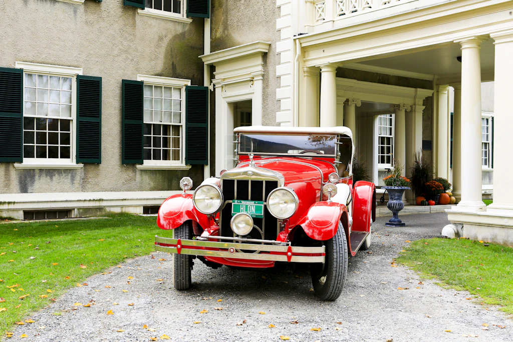 shutterstockRF_454194994.jpg A red vintage car outside Hildene - the Lincoln Family Home