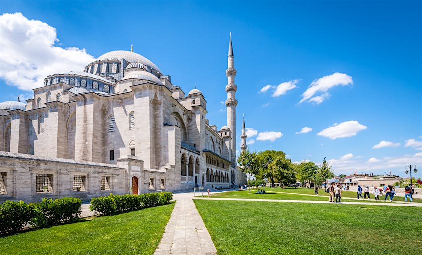 Tourists visiting Suleymaniye mosque at sunny day in Istanbul, Turkey Tourists visiting Suleymaniye mosque at sunny day in Istanbul, Turkey