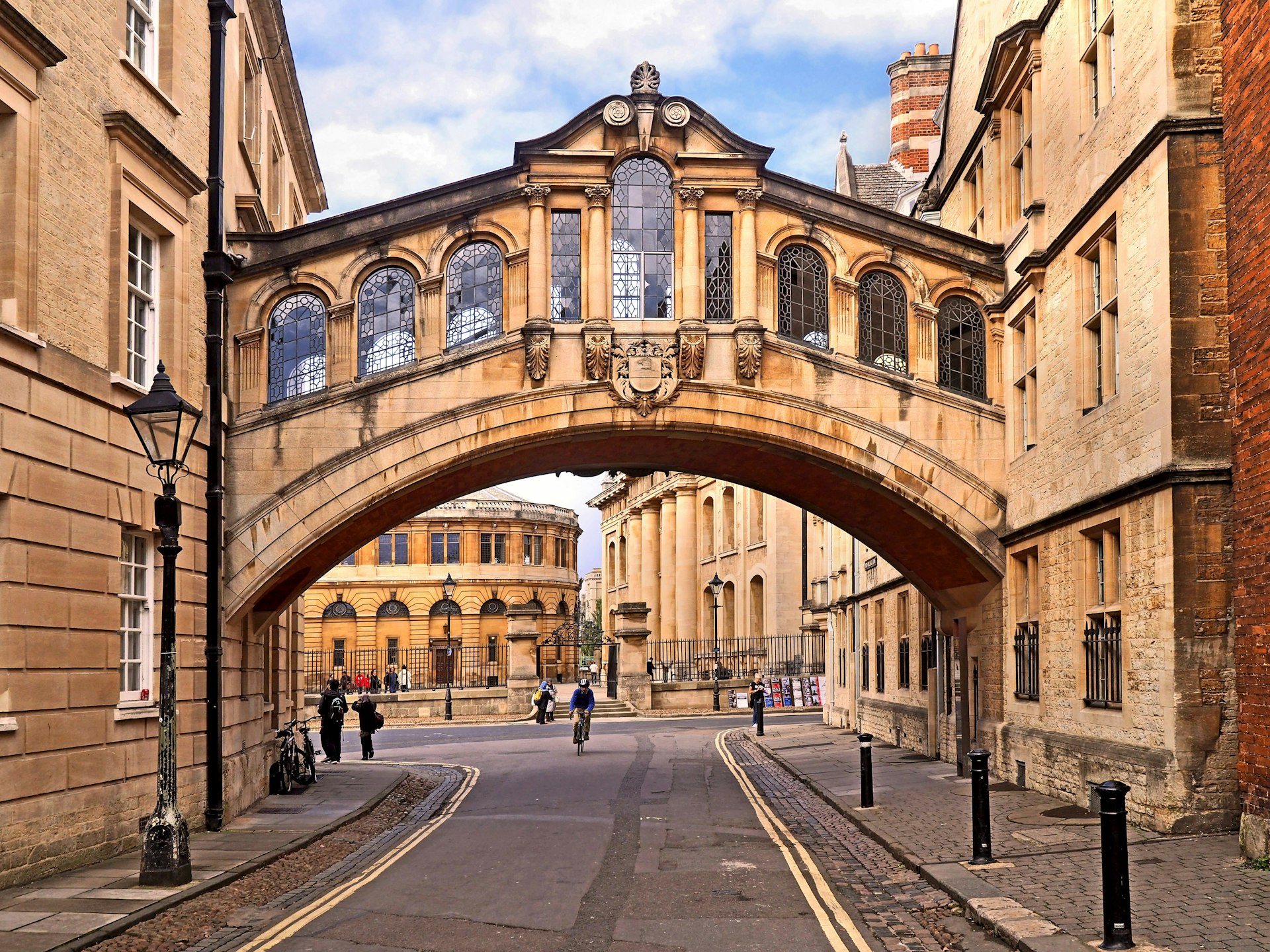 A Venetian-style bridge built over a small road in Oxford