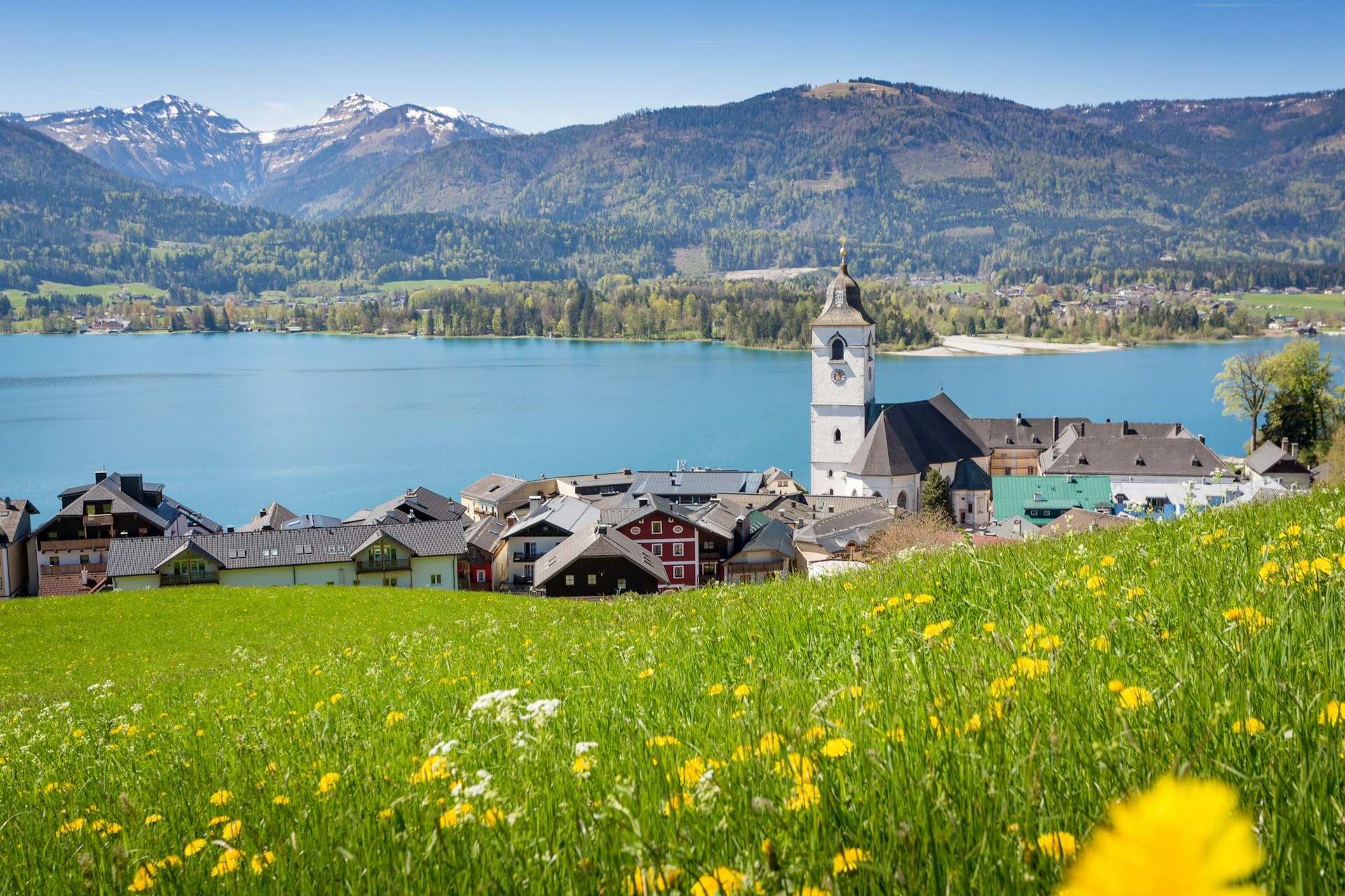 View over St. Wolfgang with Wolfgangsee lake, Salzkammergut, Austria with flowers