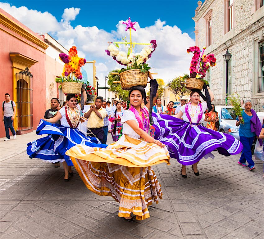 Women in traditional dress celebrating Dia de la Virgen de Guadalupe in Oaxaca City
