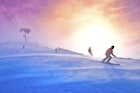 Skiers on the windy track under ski lift - colorful vivid sport picture