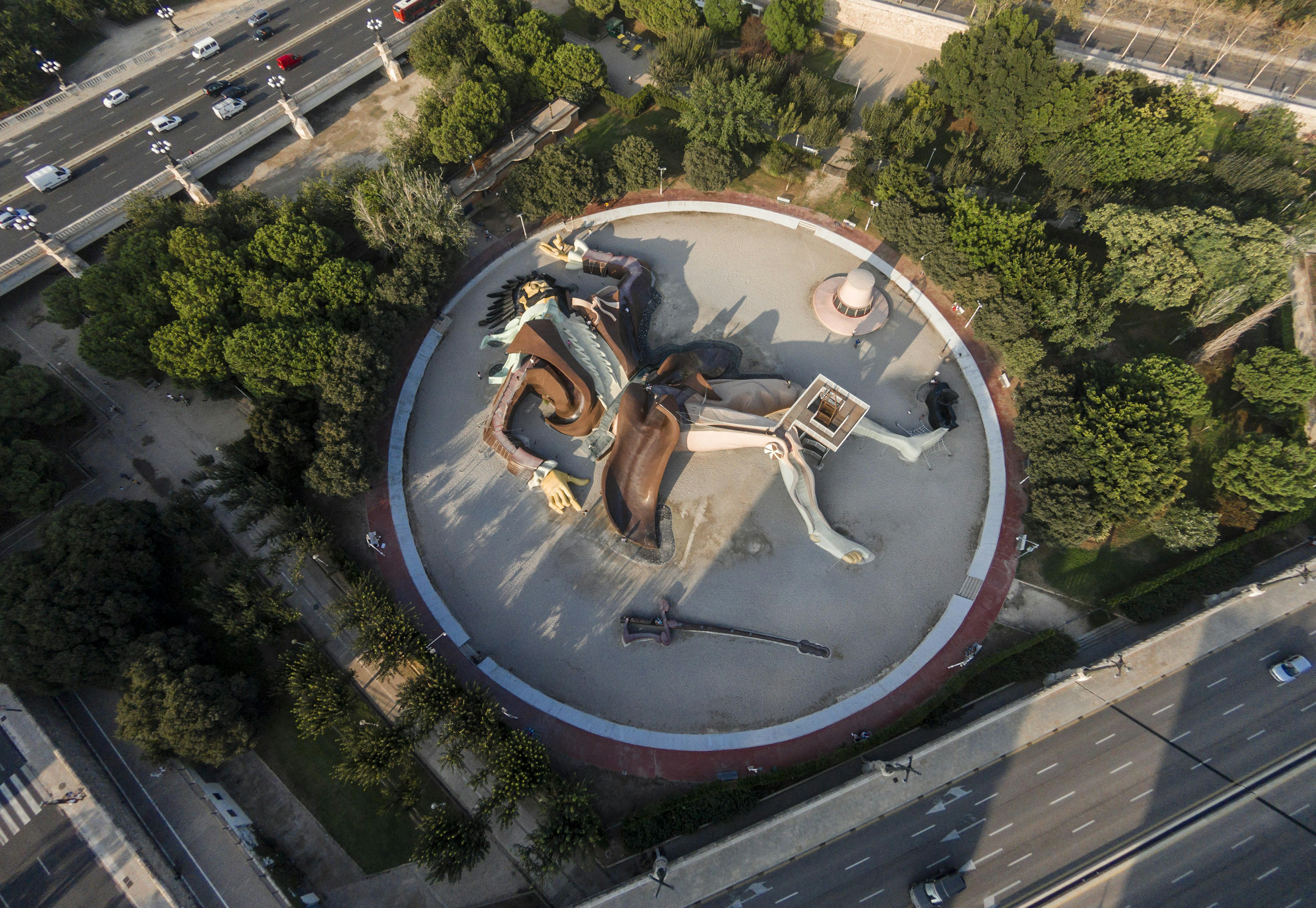 An aerial view of the giant Gulliver playground – a man sprawled out – in Jardines del Turia