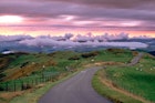 Wales, Powys, near Machynlleth, storm cloud sunset, winding road