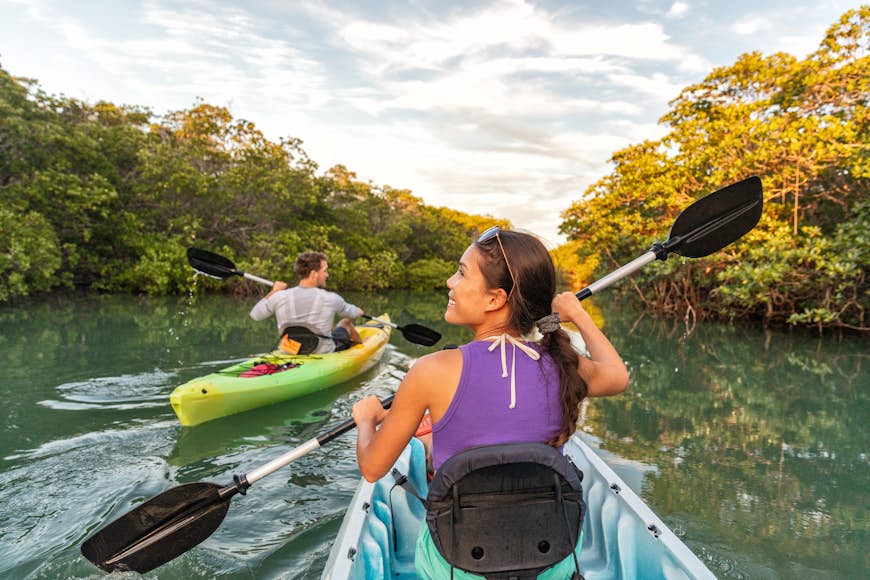 Couple kayaking together in mangrove river on Islamorada, Florida Keys 