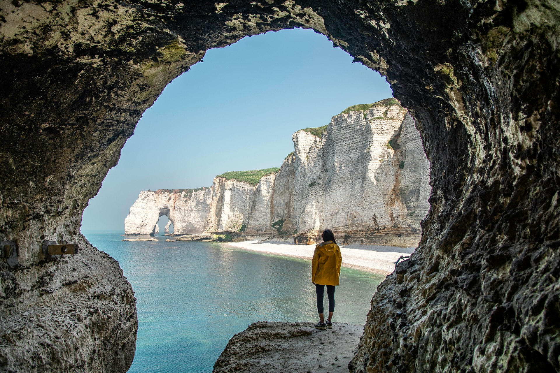 A cave frames the shoreline at Etretat, Normandy