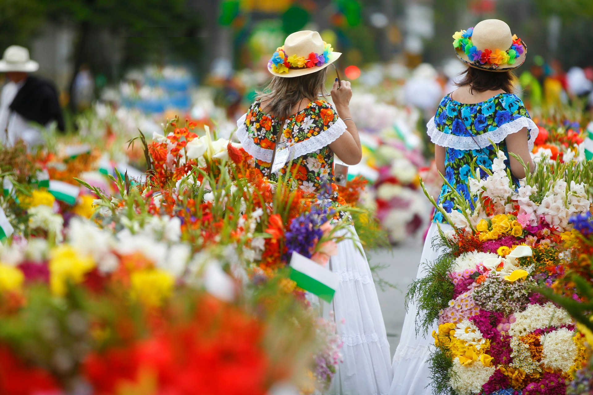Women in floral colors at the Feria de las Flores 