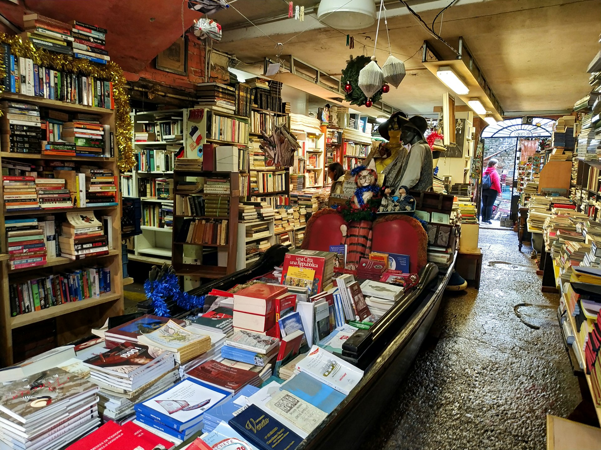 Books stacked in a gondola, in bookshop Acqua Alta, Venice, Italy