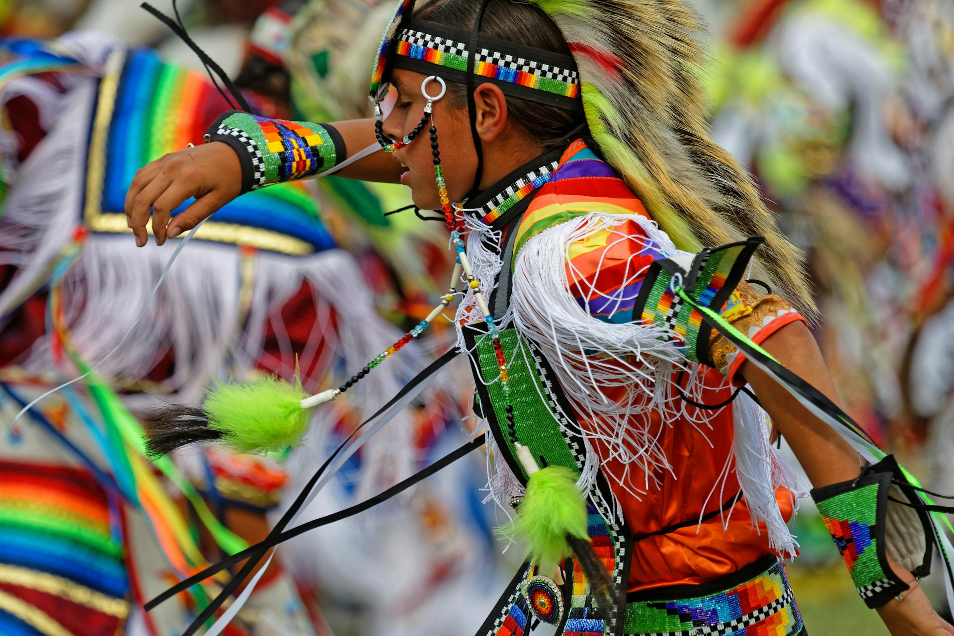 A young man dances at the 49th annual United Tribes Powwow