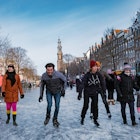 Amsterdam Netherlands February 2021,Ice skating on the canals in Amsterdam the Netherlands in winter, frozen canals in Amsterdam during winter