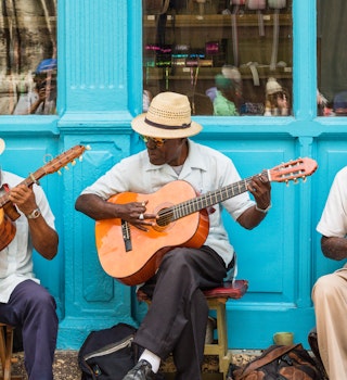 Havana, Cuba - March 24, 2017: Elderly street musicians playing traditional cuban music on the street in old Havana