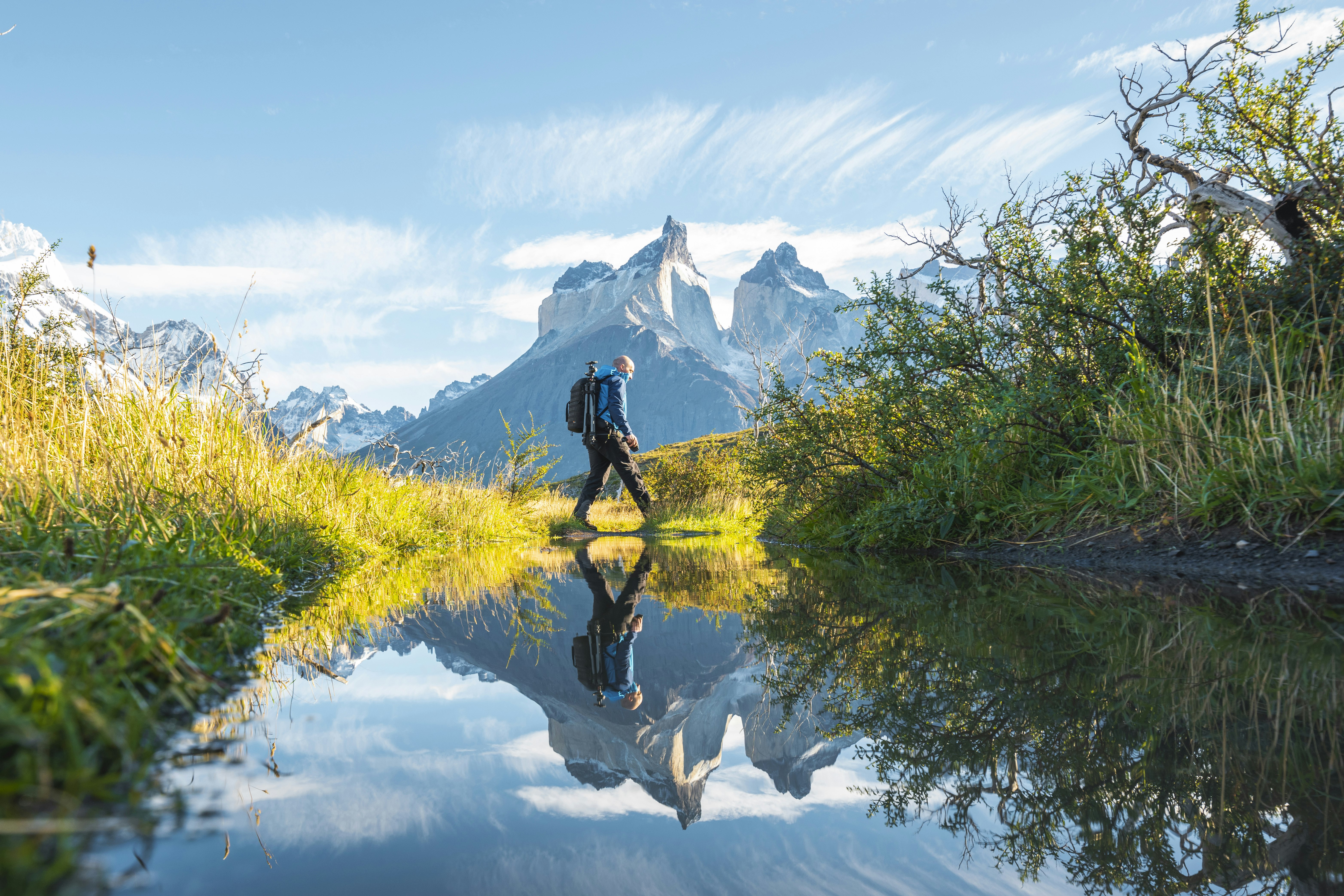One man crossing a pond in Torres del Paine National Park, Chile