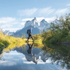 One man crossing a pond in Torres del Paine National Park, Chile