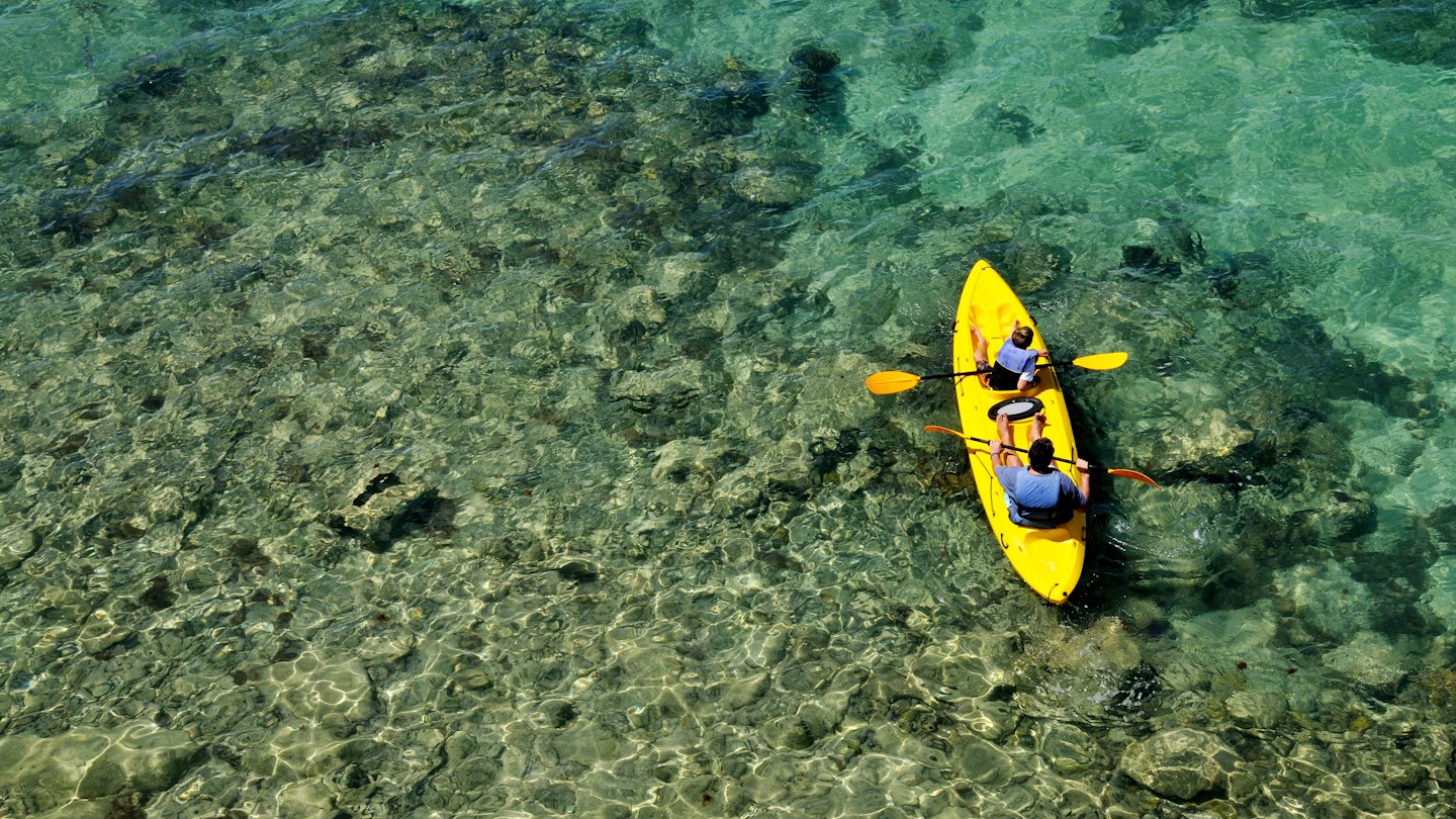Father and son kayaking at Fort Hamilton, Bermuda.