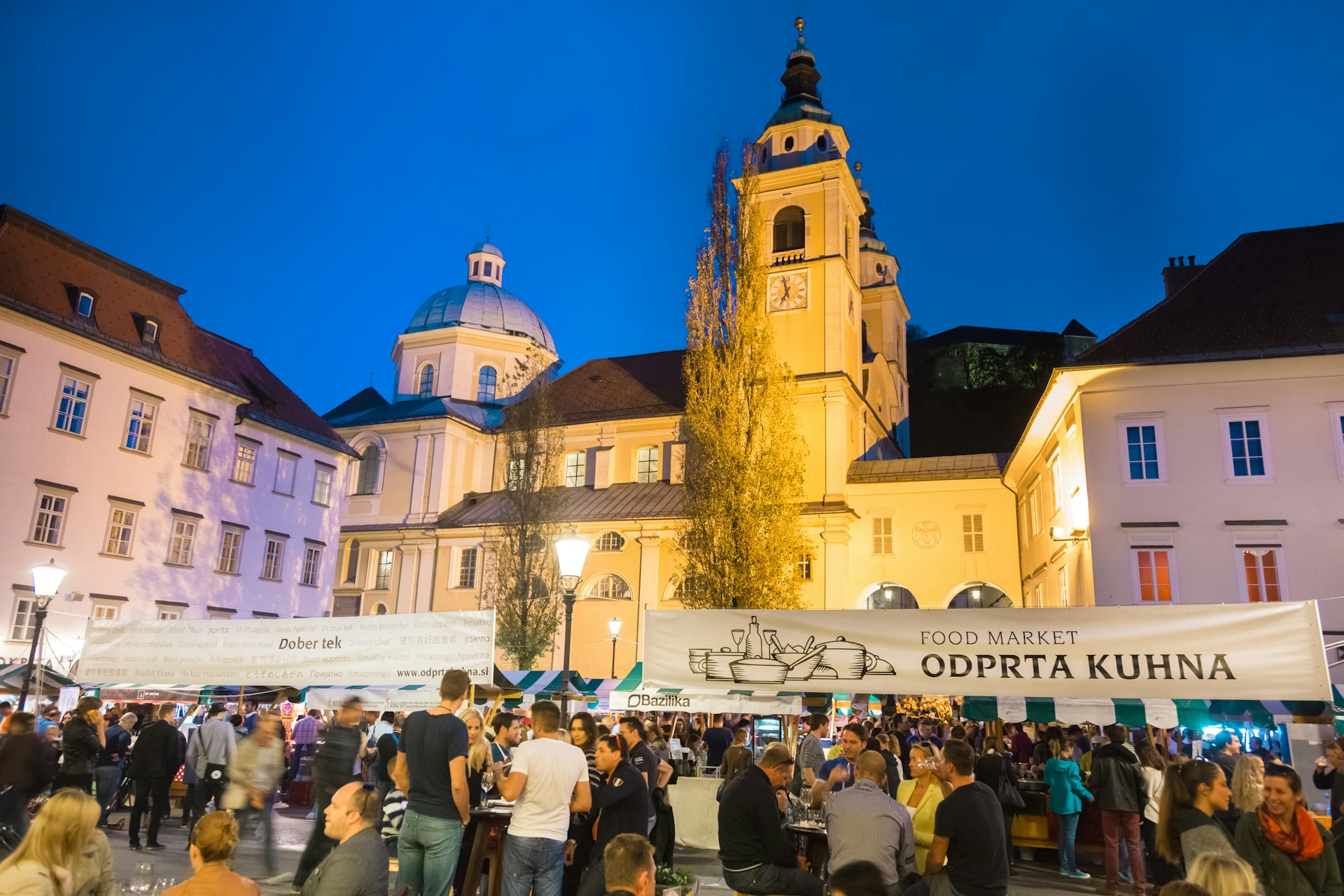 Crowds at a market at night in Ljubljana, Slovenia 