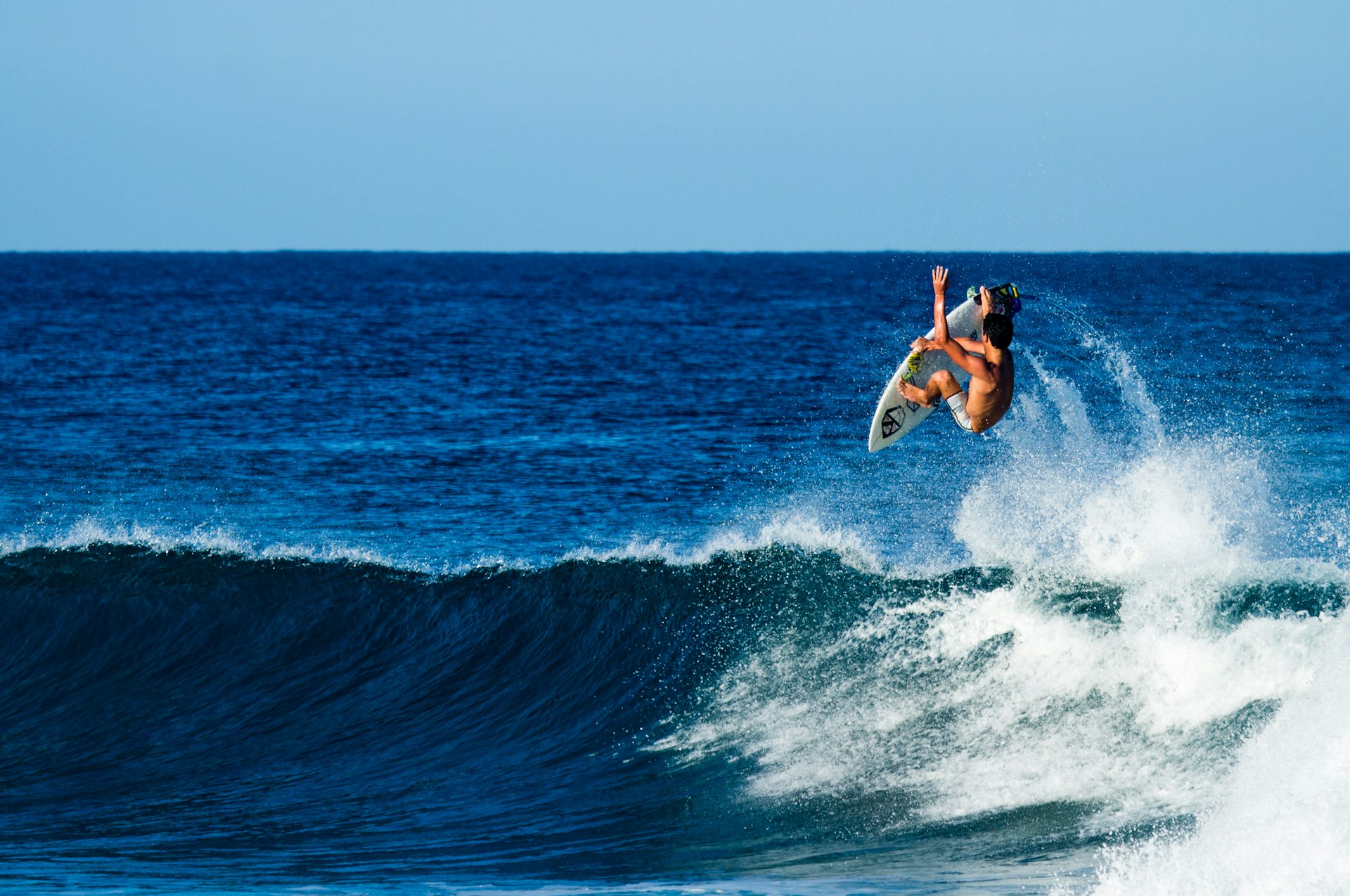 A surfer performing an aerial near Rincón