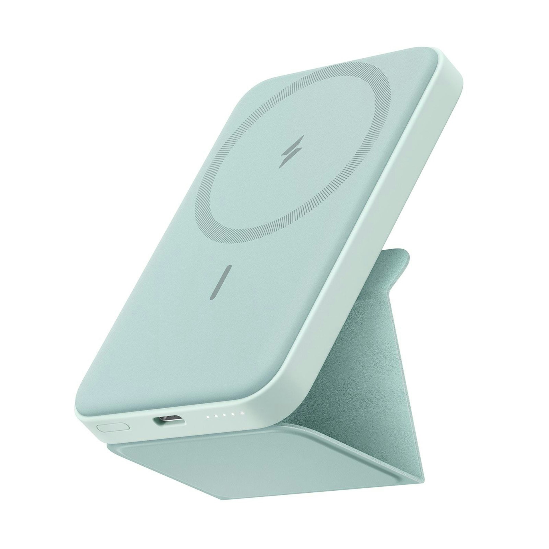 The Anker 622 Magnetic Battery in mint green, propped up with the kickstand
