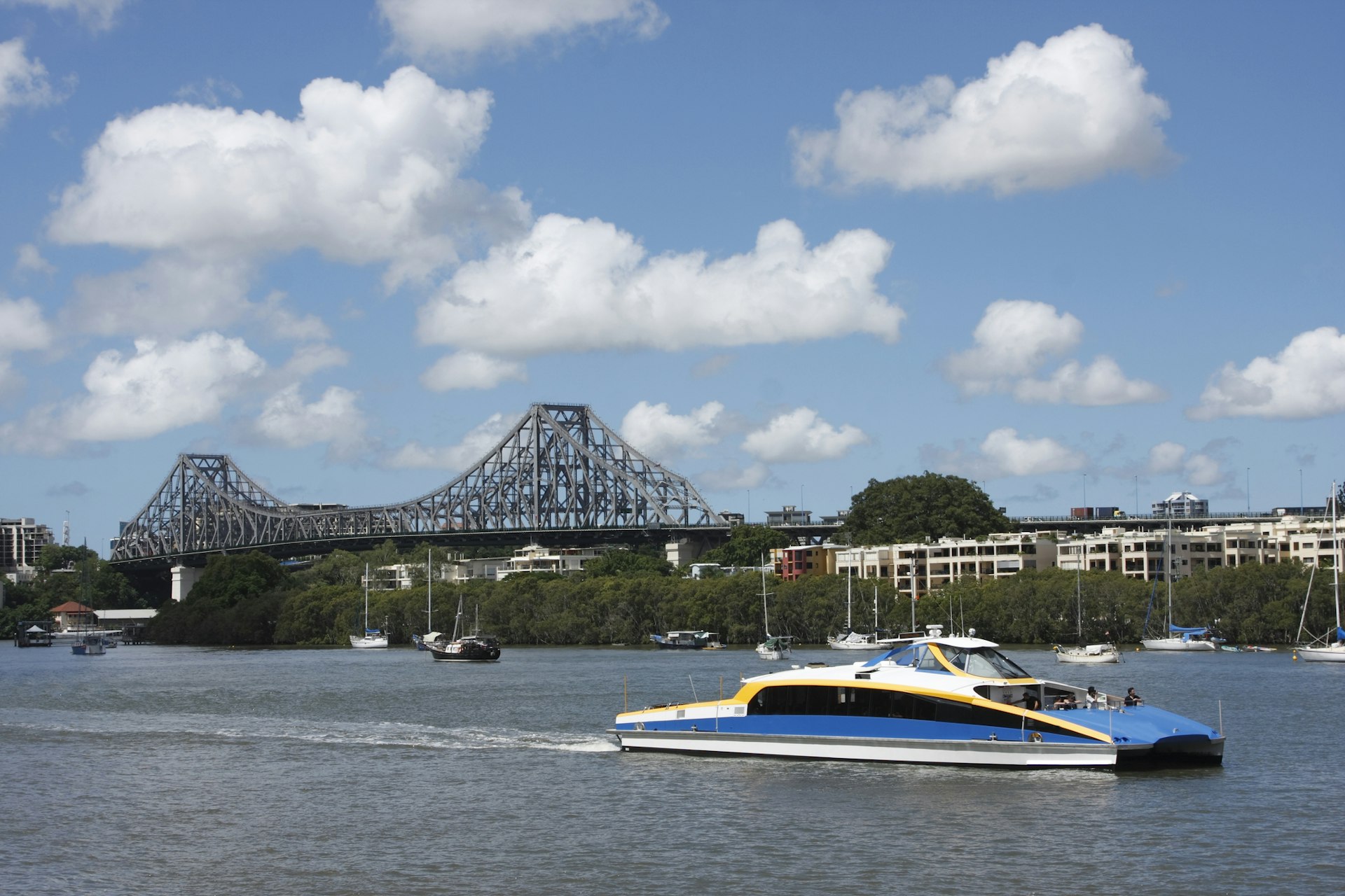 The commuter ferry on Brisbane River. Story Bridge in the background. 