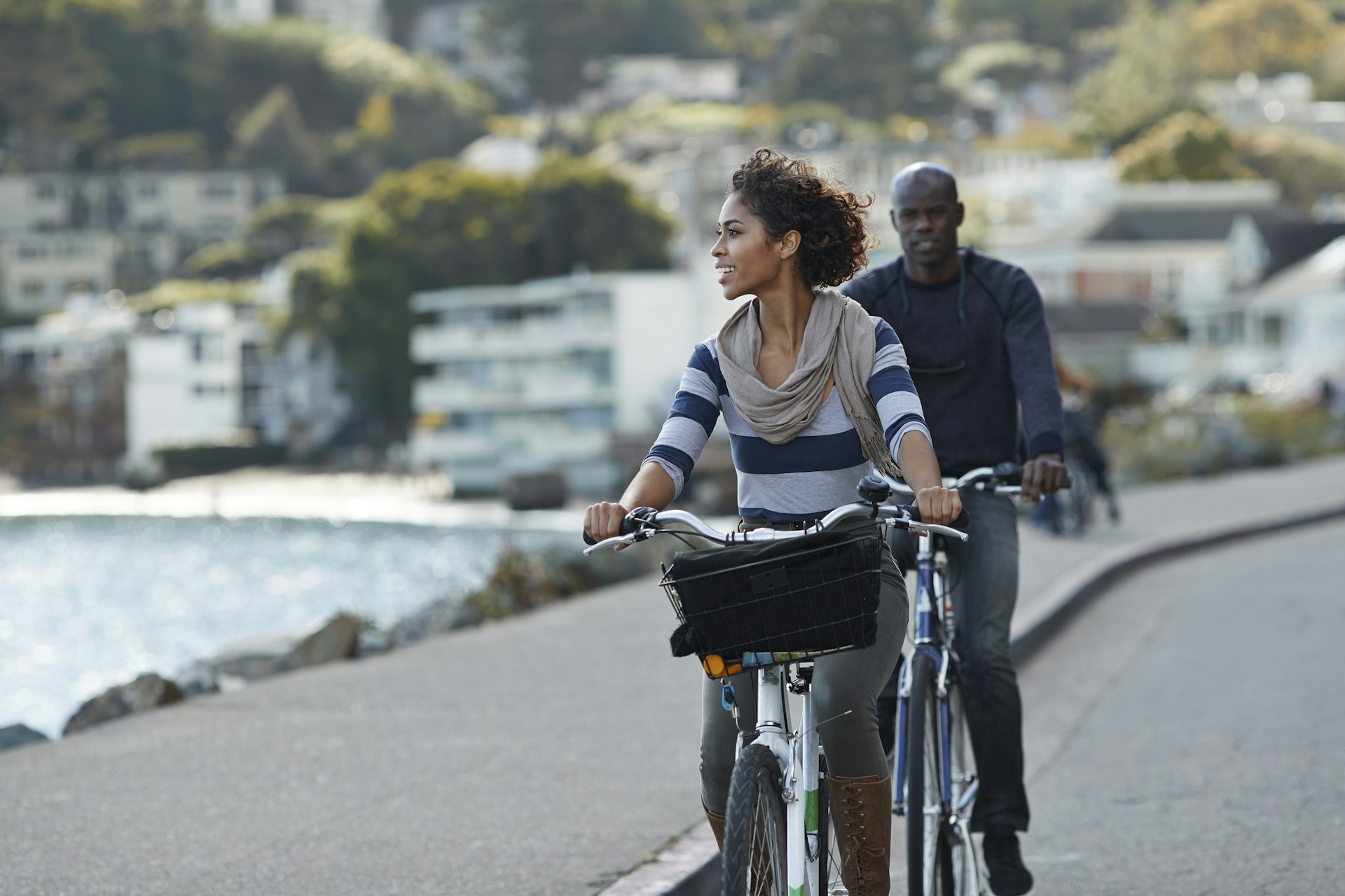 A couple cycling along the waterfront in San Francisco
