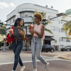 Two female friends walking in Miami Beach