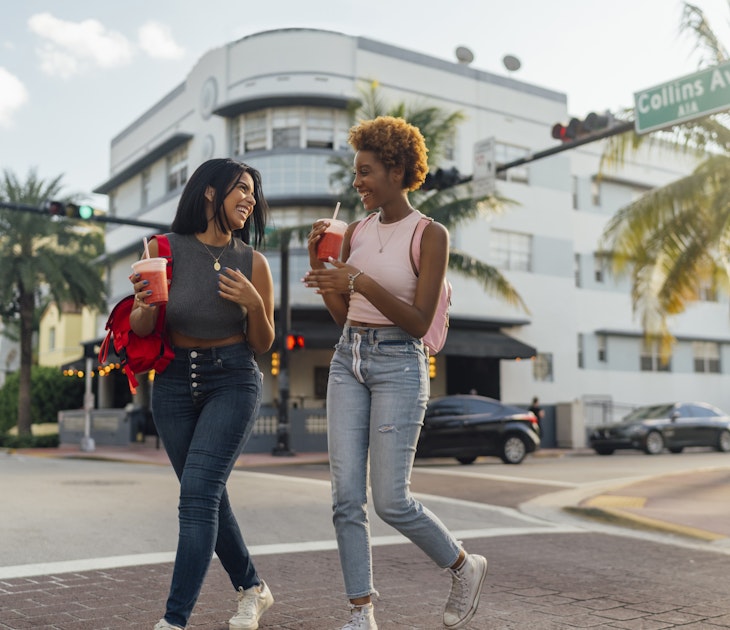 Two female friends walking in Miami Beach