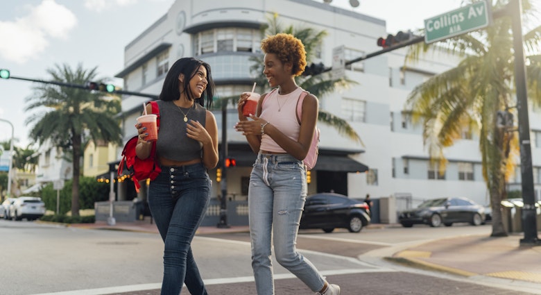 Two female friends walking in Miami Beach