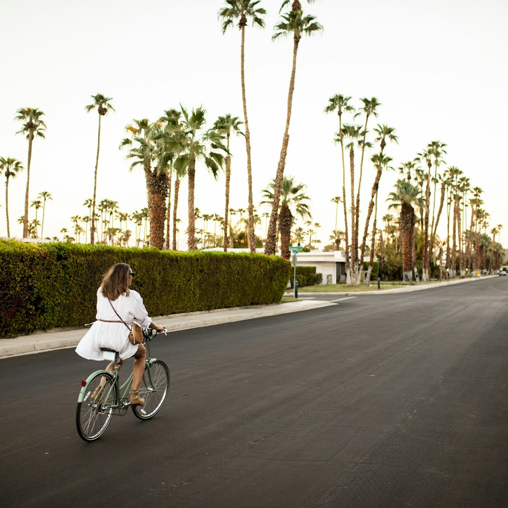 USA, California, Palm Springs, woman riding bicycle on the street