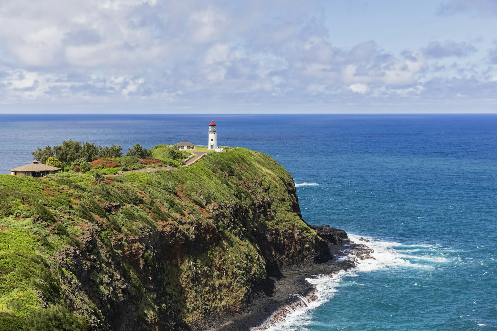 An aerial view of the lighthouse overlooking the cliffs and Pacific Ocean at Kilauea Point National Wildlife Refuge, Kaua‘i