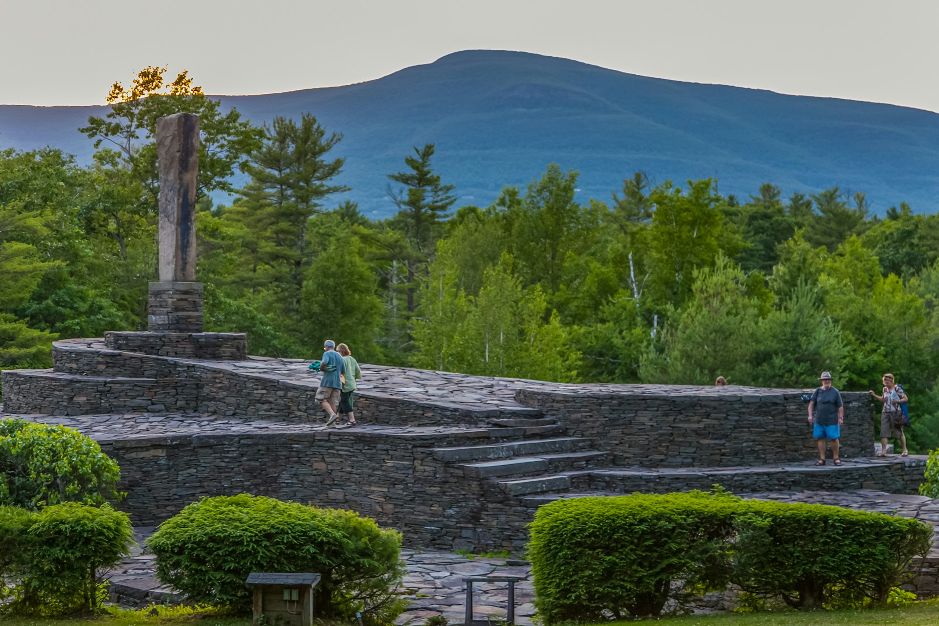 People walking over the sprawling Opus 40 earthwork sculpture in Saugerties, in the heart of New York's Hudson Valley