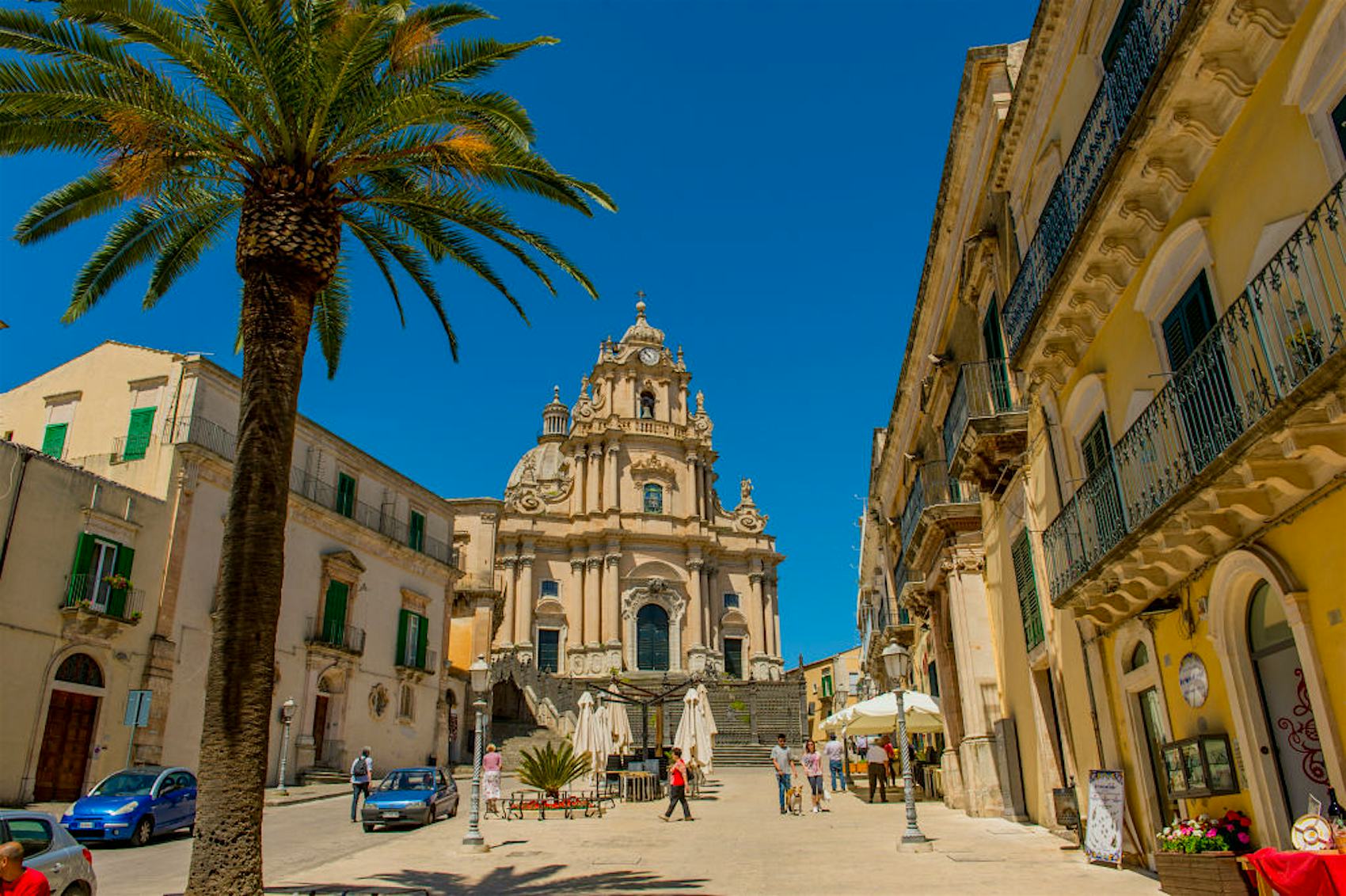 ITALY - 2015/05/12: City square with the Cathedral of San Giorgio (Saint George) in the town of Ragusa Ibla, on the island of Sicily in Italy.