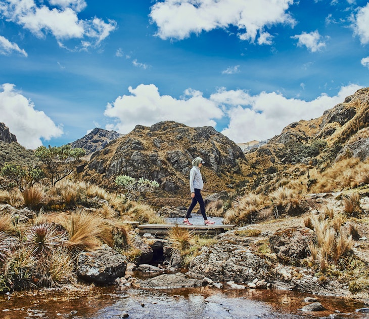 Woman walking in the mountains in Ecuador