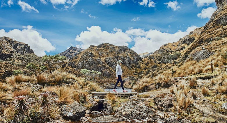 Woman walking in the mountains in Ecuador