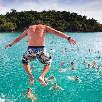 A popular activity in Sihanoukville, Cambodia is the Dolphin Shack booze cruise which takes backpackers out to swim and party at various islands