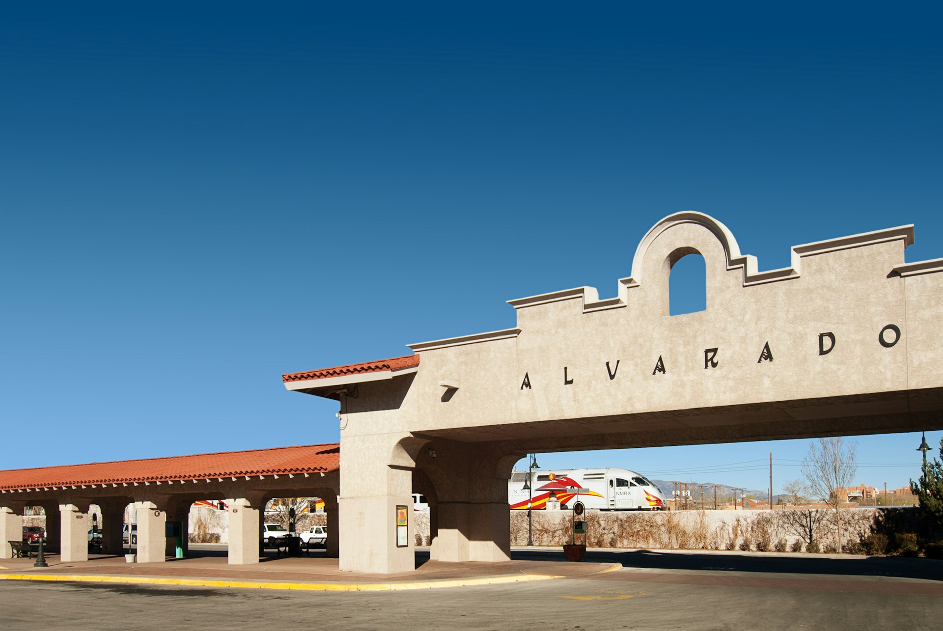 A transportation entryway reading "Alvarado" in a Spanish Colonial style