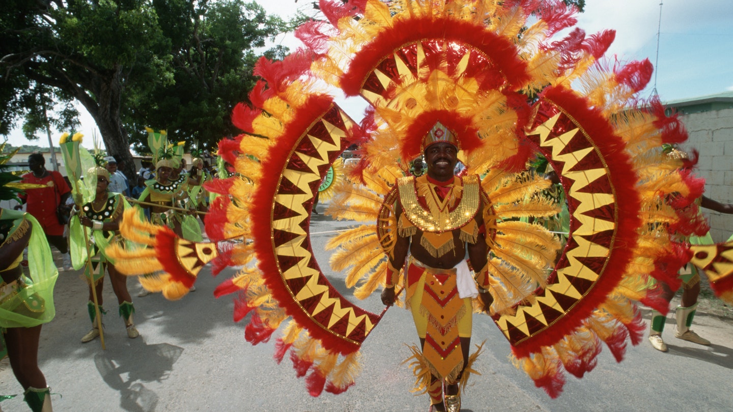 A man participates in the Parade of Troupes during Carnival Week Anguilla