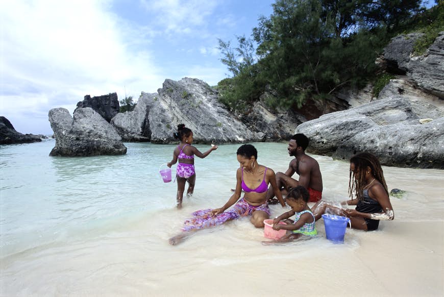 A family with children relaxing on a Bermuda beach